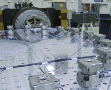 Spacecraft payloads undergo extreme vertical and horizontal vibration testing